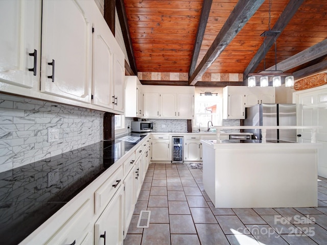 kitchen featuring white cabinets, wine cooler, vaulted ceiling with beams, appliances with stainless steel finishes, and wood ceiling