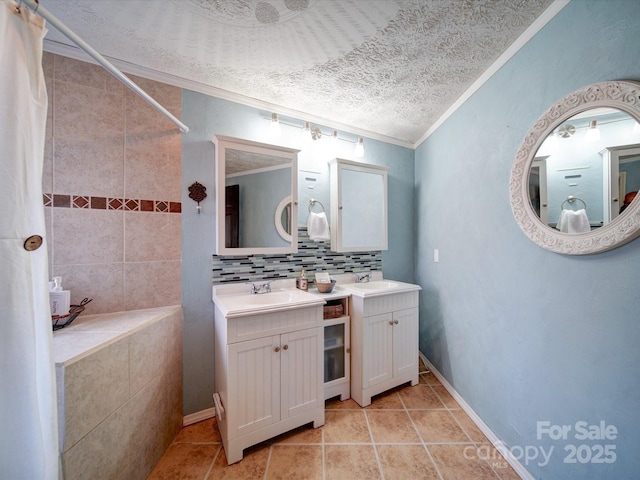 bathroom with decorative backsplash, tile patterned floors, vanity, a textured ceiling, and crown molding