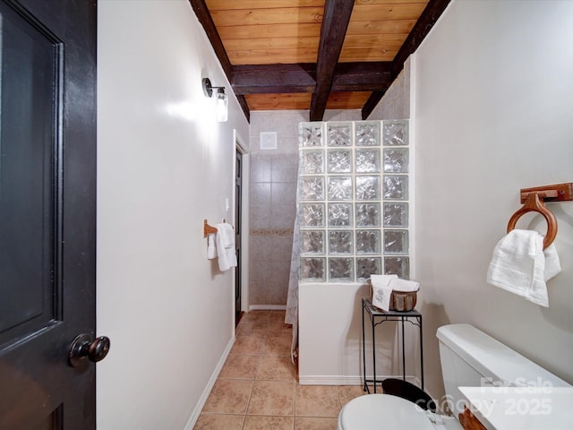 bathroom featuring tile patterned flooring, toilet, wood ceiling, and beamed ceiling