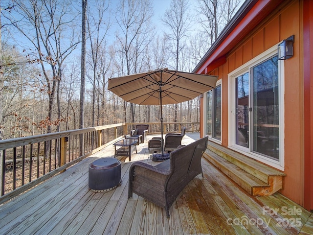 deck with an outdoor hangout area