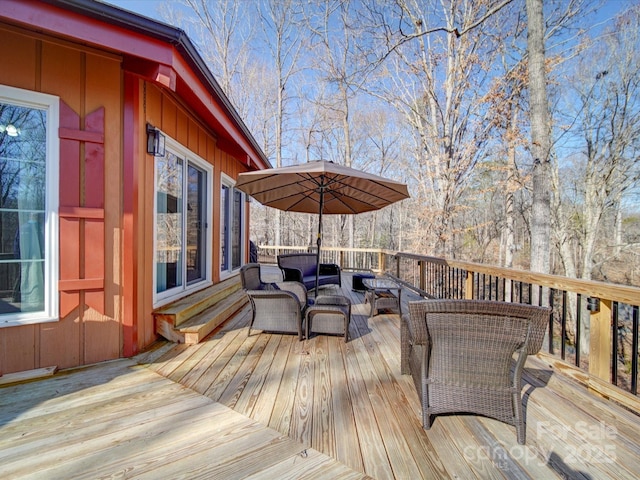 wooden deck featuring an outdoor hangout area