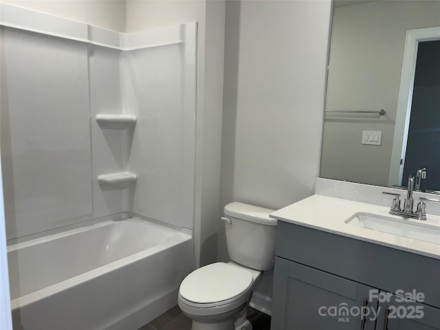 bathroom featuring toilet, shower / tub combination, and vanity