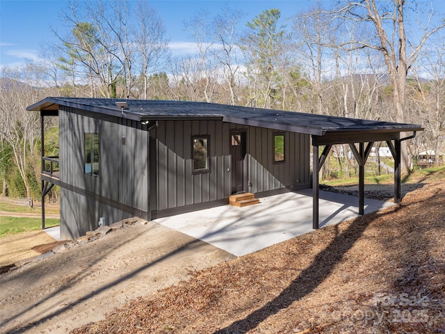 18 Cane Creek Ln, Fairview, NC 28730 - view of front facade featuring a carport, board and batten siding, and a mountain view