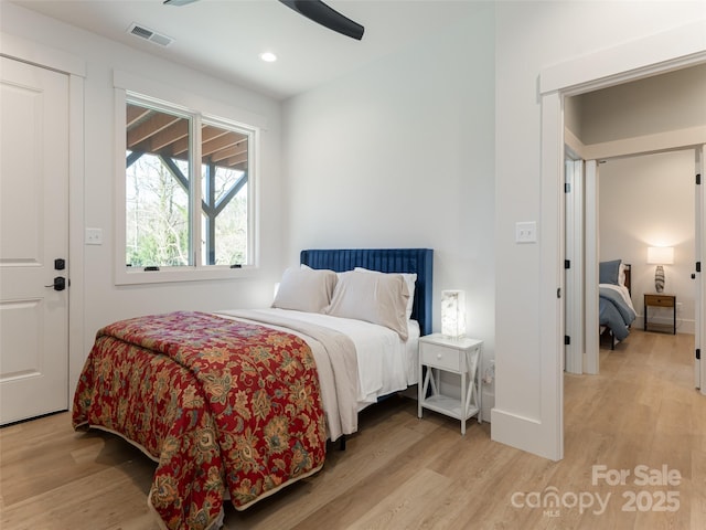 bedroom featuring ceiling fan and light hardwood / wood-style flooring