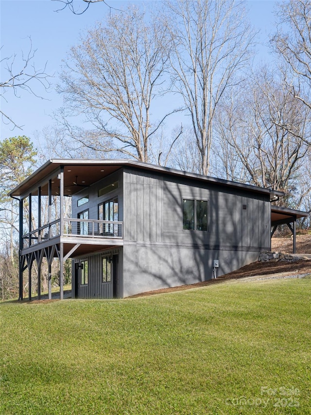 view of side of property with a yard