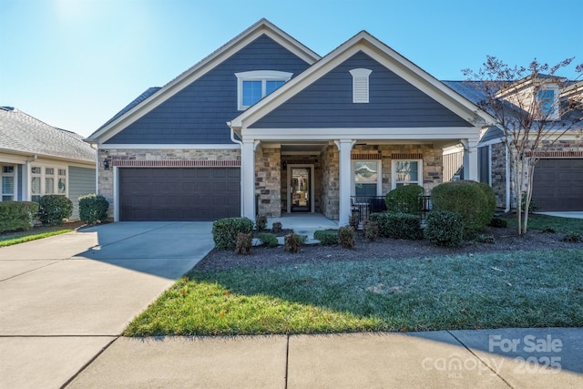 view of front of house with a garage and covered porch