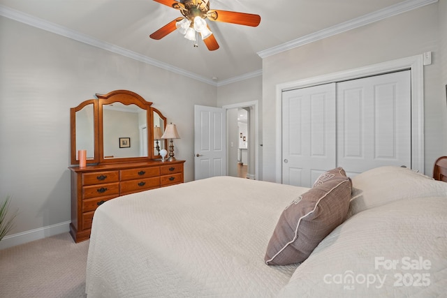 bedroom featuring carpet flooring, a closet, ceiling fan, and ornamental molding