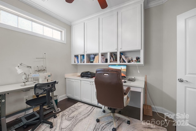 office space with ceiling fan, dark wood-type flooring, and ornamental molding