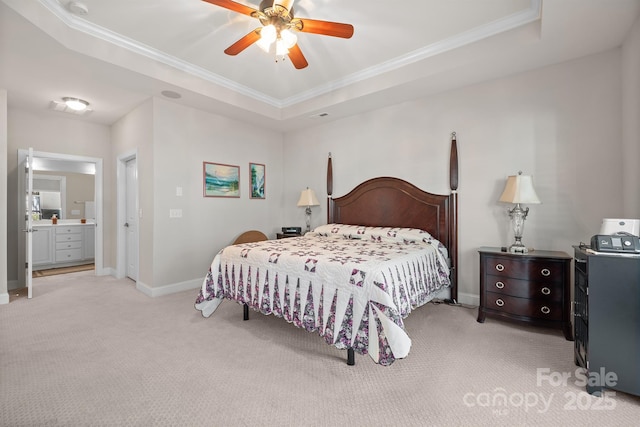 bedroom with ceiling fan, ornamental molding, light carpet, and a tray ceiling