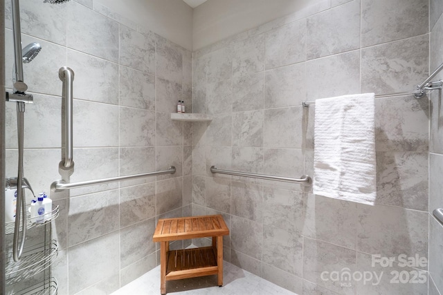 bathroom with tiled shower