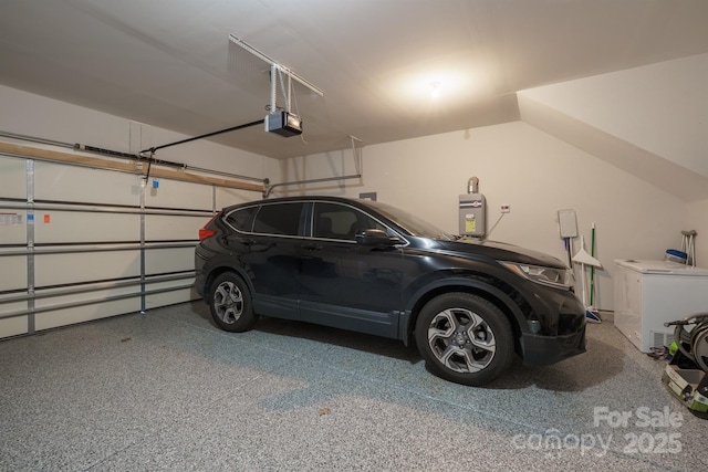 garage featuring refrigerator and a garage door opener