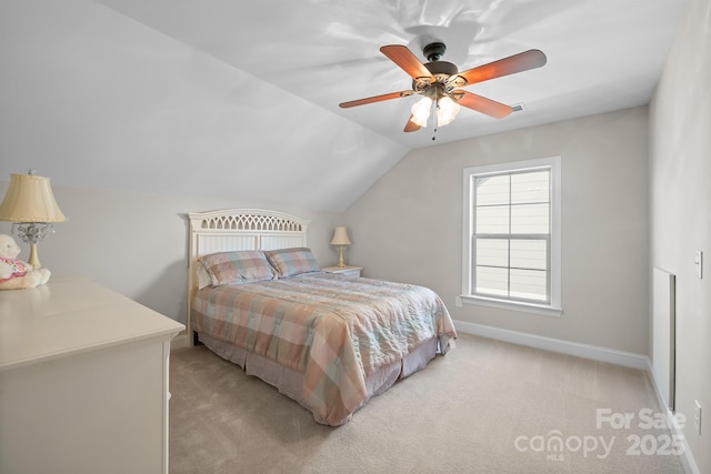 carpeted bedroom with ceiling fan and lofted ceiling