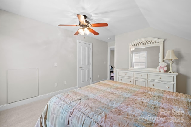 carpeted bedroom featuring ceiling fan, lofted ceiling, and a closet