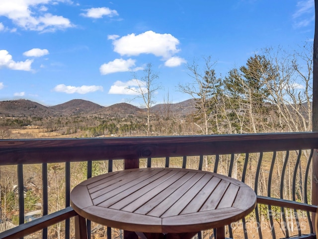 wooden terrace featuring a mountain view