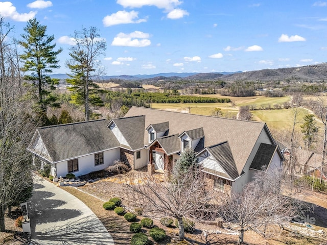 drone / aerial view featuring a mountain view