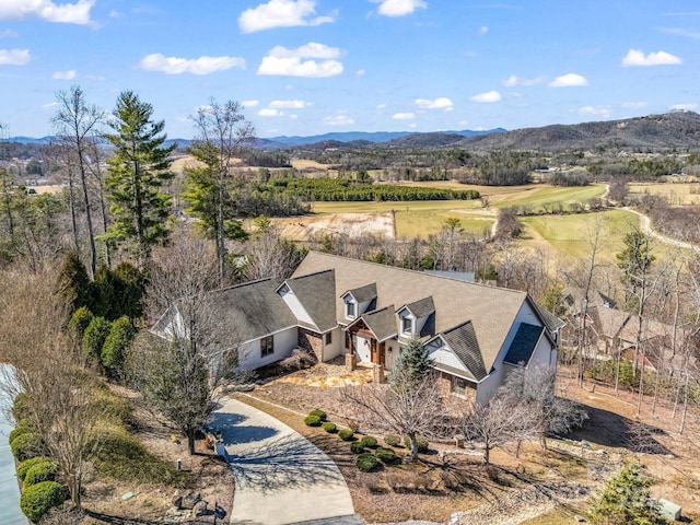 birds eye view of property featuring a mountain view