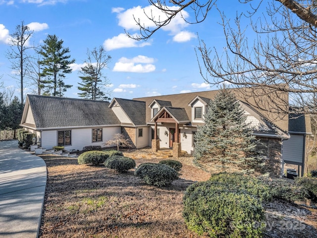 view of front of property with a shingled roof