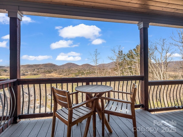 wooden terrace featuring a mountain view