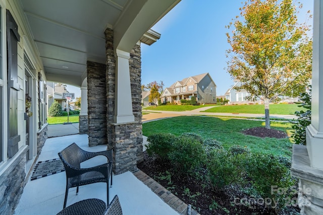 view of yard featuring covered porch