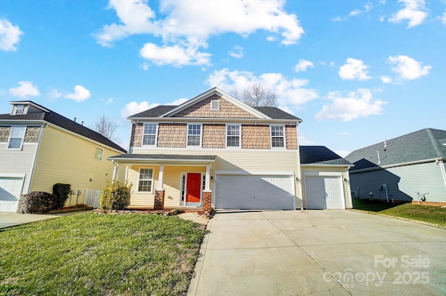 front of property featuring a porch, a garage, and a front yard