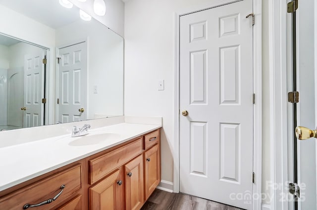 bathroom featuring hardwood / wood-style floors and vanity