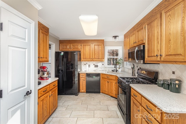 kitchen featuring backsplash, crown molding, light tile patterned floors, and black appliances