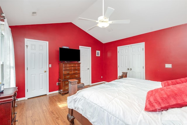 bedroom featuring ceiling fan, vaulted ceiling, and light wood-type flooring