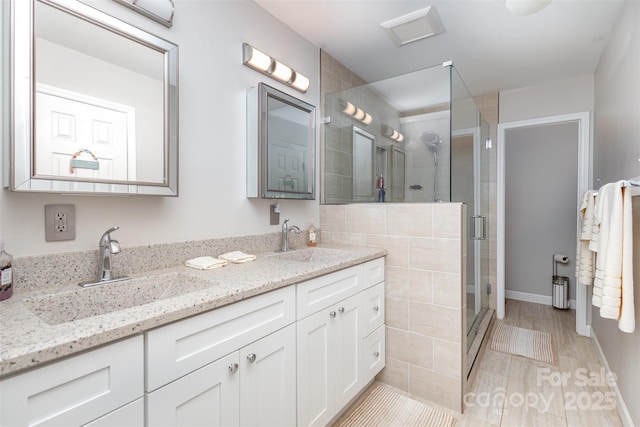 bathroom featuring vanity and walk in shower