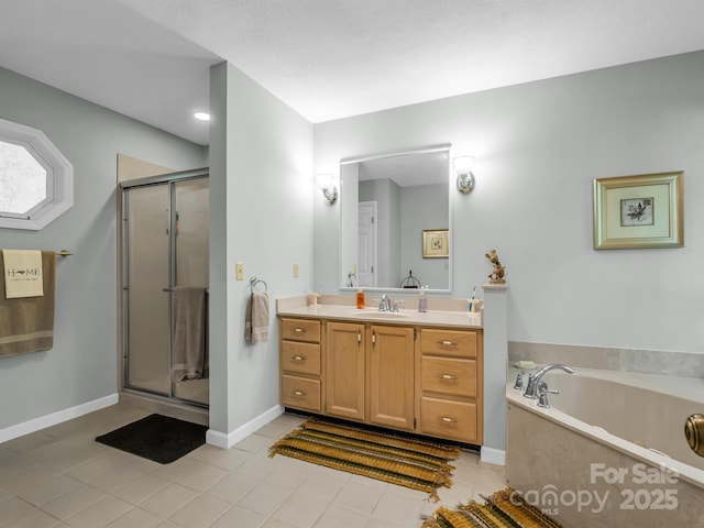 bathroom featuring tile patterned floors, vanity, and shower with separate bathtub