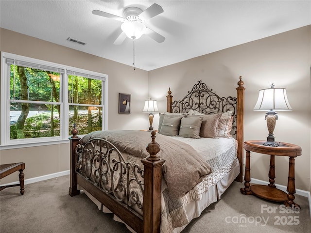 bedroom with ceiling fan and carpet floors