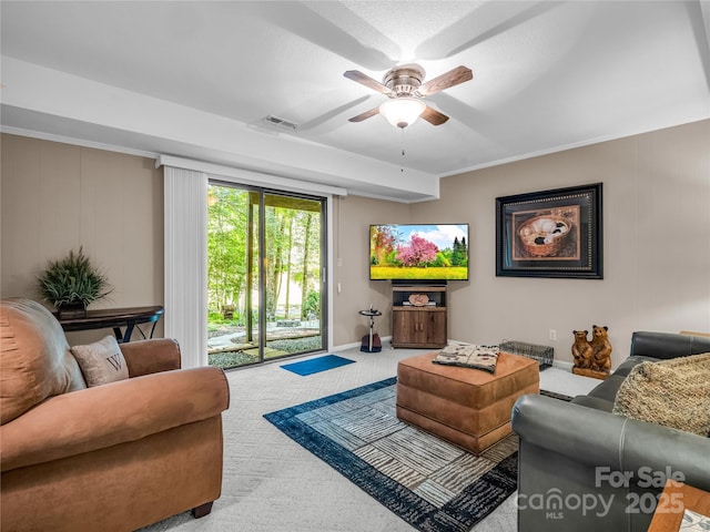 living room featuring ceiling fan and light colored carpet