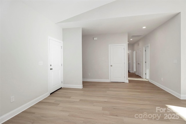 spare room featuring light hardwood / wood-style floors