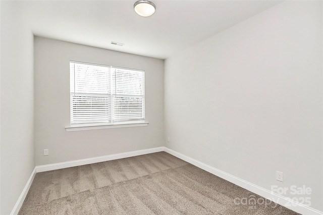 unfurnished room featuring carpet flooring