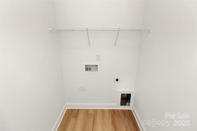 laundry room featuring electric dryer hookup, washer hookup, hardwood / wood-style flooring, and hookup for a gas dryer