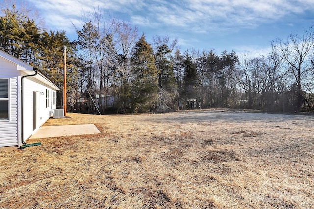 view of yard featuring central AC unit