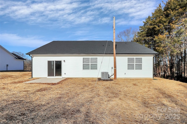 back of property featuring a yard, a patio area, and central air condition unit