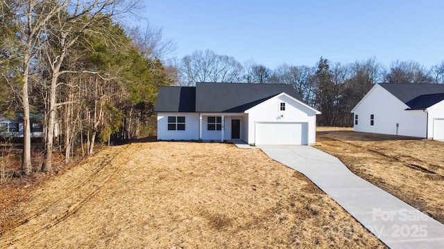 single story home with a garage