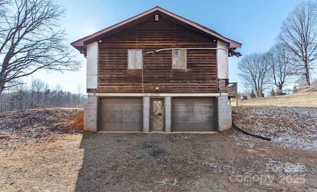 view of property exterior with a garage