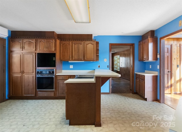 kitchen with a center island and black oven