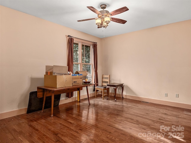 office space with hardwood / wood-style floors and ceiling fan