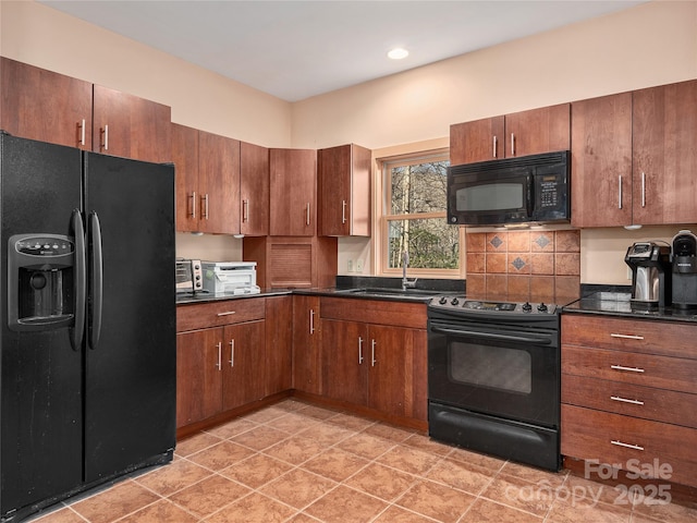 kitchen featuring light tile patterned flooring, a sink, dark countertops, black appliances, and decorative backsplash