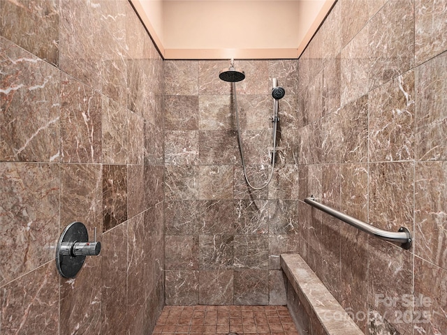 full bathroom with tiled shower
