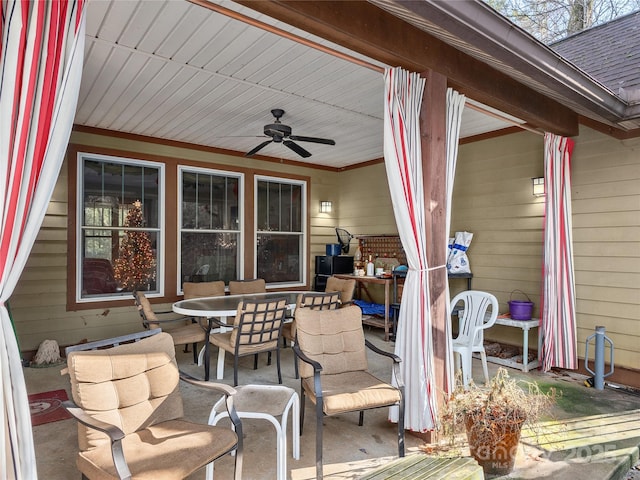 deck featuring ceiling fan and outdoor dining space