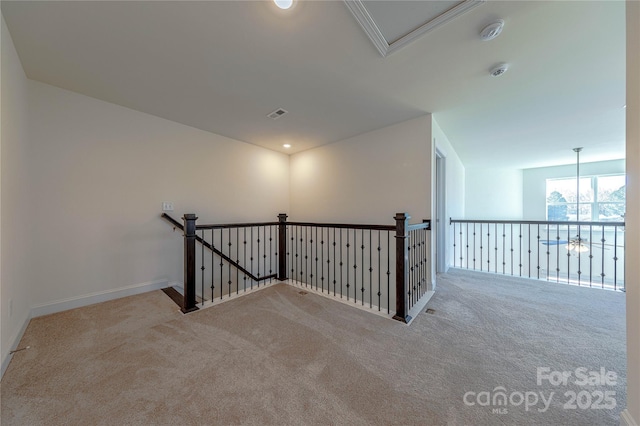 corridor with light colored carpet