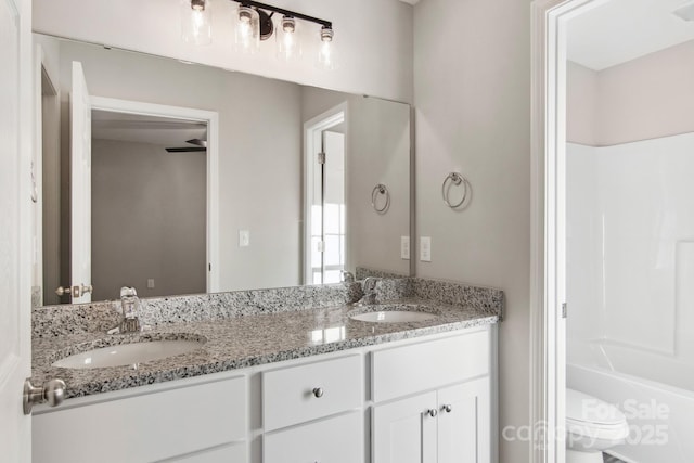 bathroom with vanity and toilet