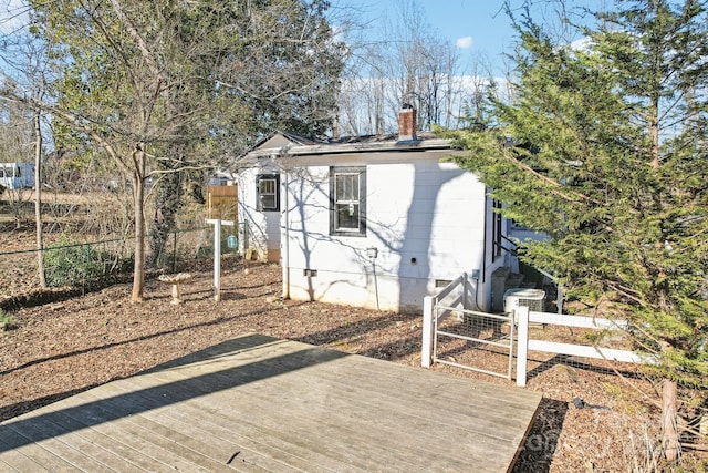 back of house featuring a deck