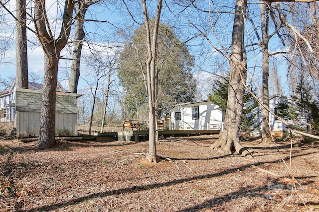 view of yard featuring a wooden deck