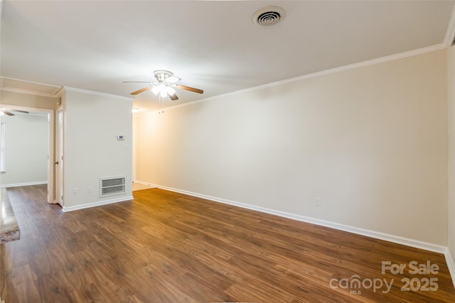 spare room featuring crown molding and hardwood / wood-style flooring