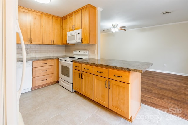 kitchen with white appliances, ceiling fan, tasteful backsplash, ornamental molding, and kitchen peninsula