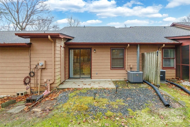 back of property featuring a patio and central air condition unit